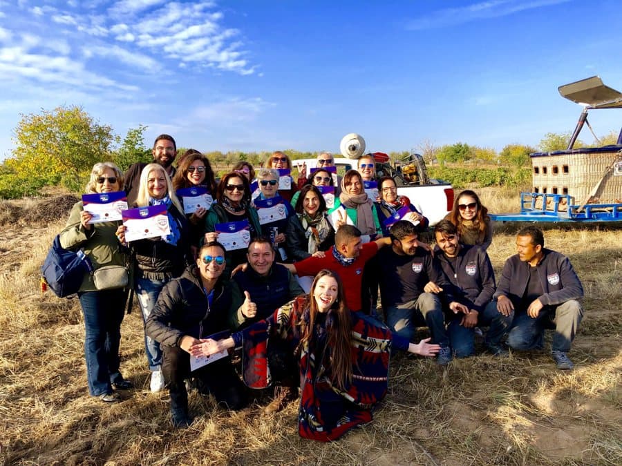A Trip Now tour group with their flag