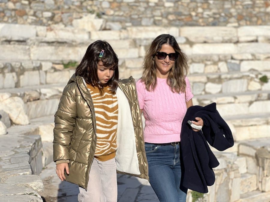 Two travelers walking the ruins at Ephesus