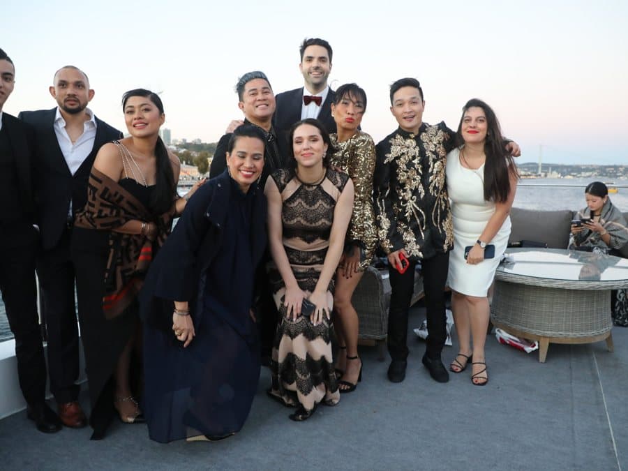 Travelers together at an evening event